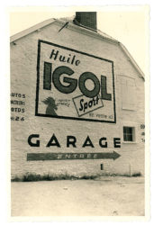 Publicité IGOL sur façade de garage.