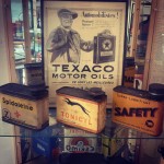 Affiche TEXACO de 1924, avec des bidons d'huiles