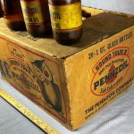 ÉTUI ANTIQUE BOUTEILLES D'HUILE MOTEUR PENNZOIL (17) POTS EN VERRE AMBRE PAPIER - QUELQUES ÉTIQUETTES (© ebay.com)