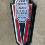 Badge Kent - Moore (1945 -1948 ?) (© servicemerchandisers.com)